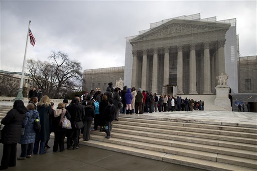 People wait in line outside the Supreme Court in Washington, Wednesday, Feb. 27,2013, to listen to oral arguments in the Shelby County, Ala., v. Holder voting rights case. The justices are hearing arguments in a challenge to the part of the Voting Rights Act that forces places with a history of discrimination, mainly in the Deep South, to get approval before they make any change in the way elections are held. (AP Photo/Evan Vucci)