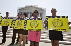 Representatives from the NAACP Legal Defense Fund standing outside the Supreme Court. Photo Credit: The Associated Press, J. Scott Applewhite.